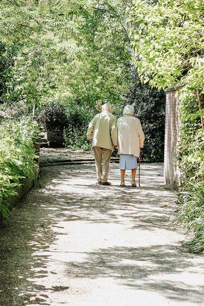 Elderly Couple on a Walk Outside