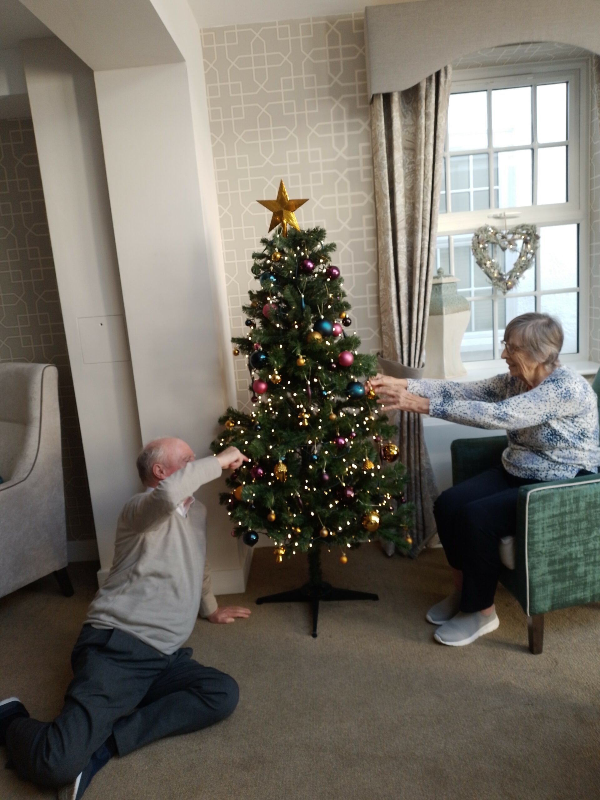 Residents Doing Christmas Tree Decorations