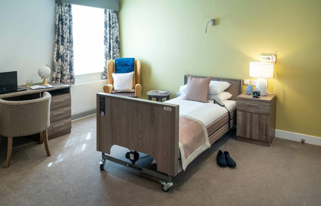 Bedroom with green wall and cosy bed