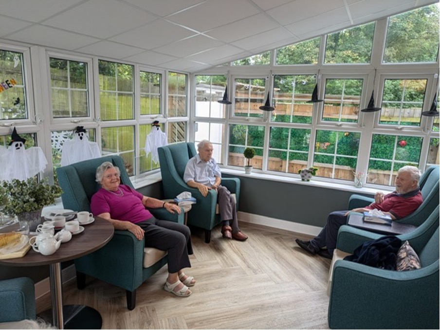 residents having a chat in comfortable armchairs